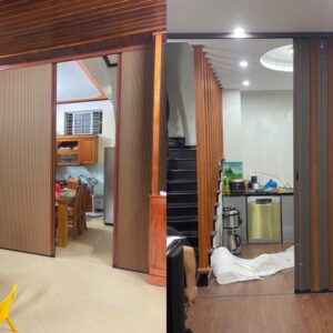 Vách ngăn tổ ong ray xích màu gỗ được sử dụng để ngăn giữa phòng bếp và phòng khách.