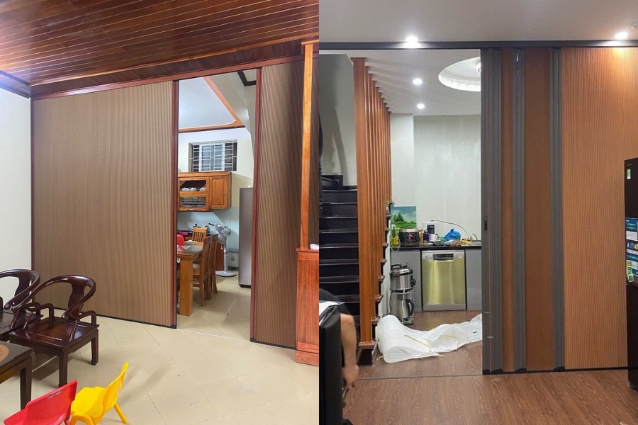 Vách ngăn tổ ong ray xích màu gỗ được sử dụng để ngăn giữa phòng bếp và phòng khách.